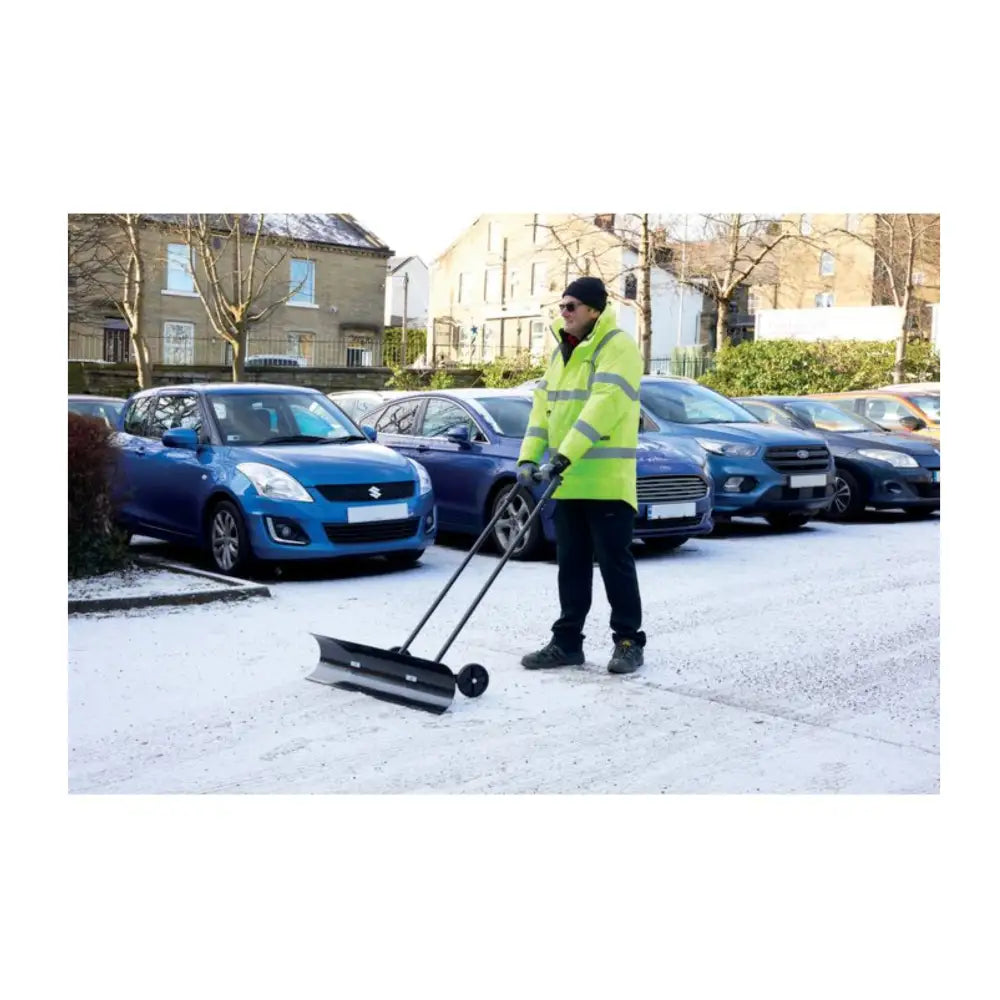 Wide wheeled snow pusher plough